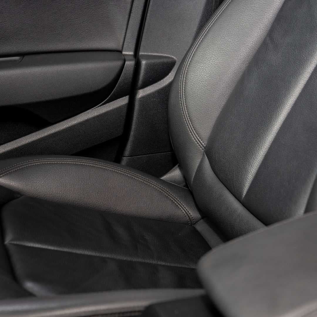 Same customer car interior with leather seats restored to factory finish after the detail