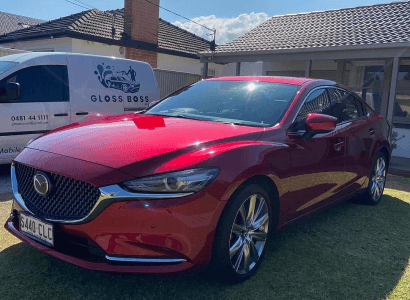 Customer Mazda6 with the Gloss Boss mobile detailing van parked behind it after an exterior detail