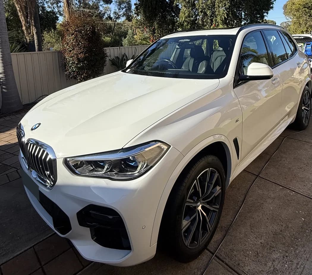 White BMW X5 showing the front and side exterior