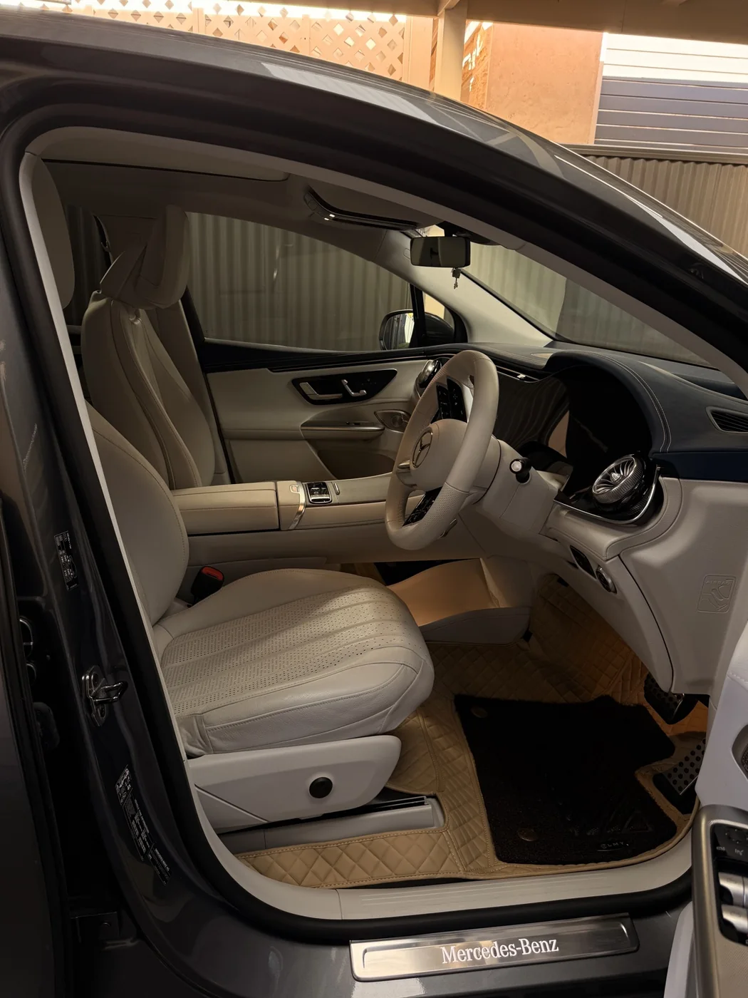 Mercedes cream leather cabin viewed through the open door