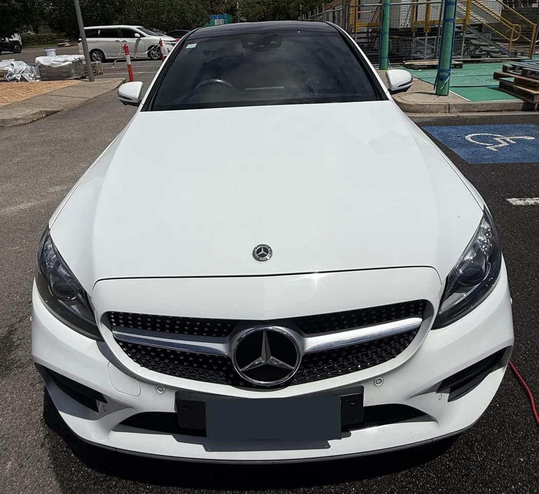 White Mercedes showing the front exterior