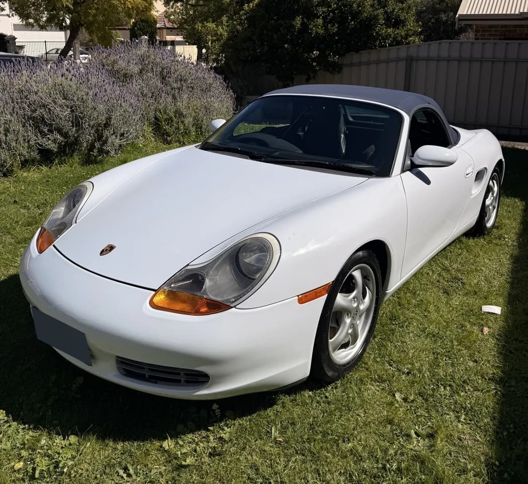 White Porsche Boxster photographed outdoors